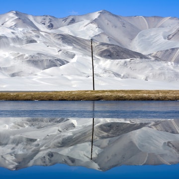 Sand dunes reflected in lake
